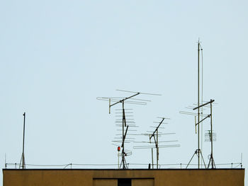 Low angle view of communications tower against clear sky