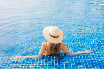 Woman swimming in pool