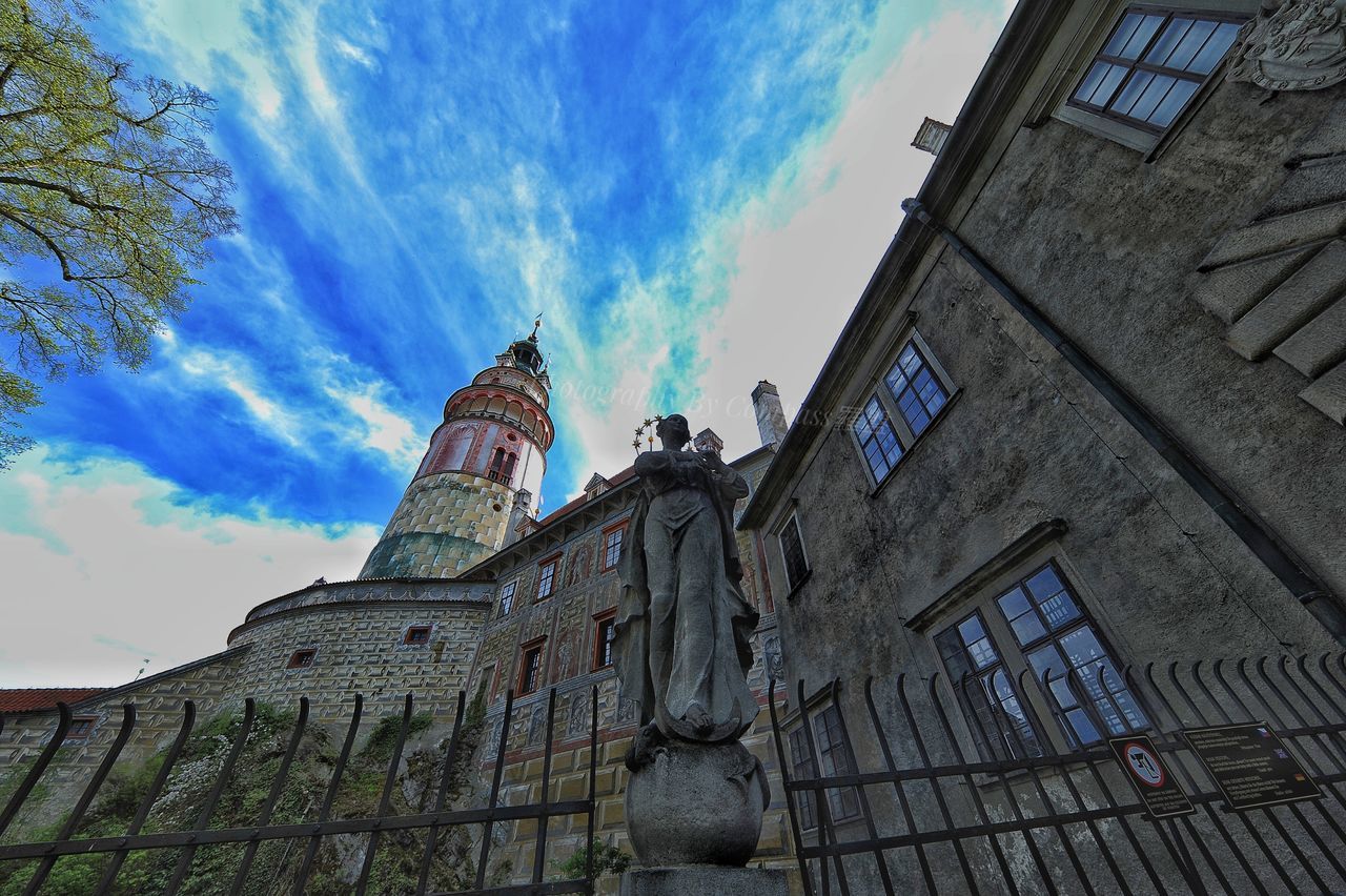 architecture, building exterior, low angle view, built structure, sky, cloud - sky, outdoors, day, history, no people, spirituality, travel destinations, statue