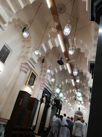 Low angle view of illuminated chandelier hanging in restaurant