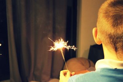 Close-up of illuminated sparkler at night