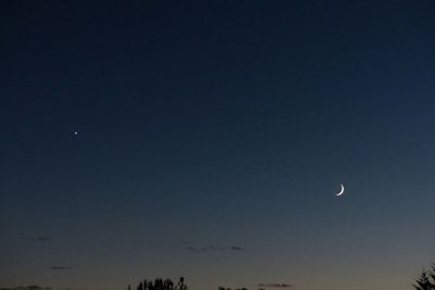 Low angle view of moon in sky