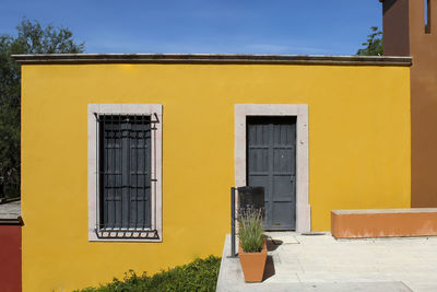 Yellow door of building