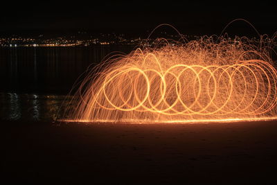 Spinning wire wool at night