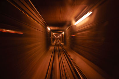 Light trails in illuminated tunnel