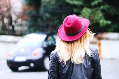Close-up of young woman wearing hat