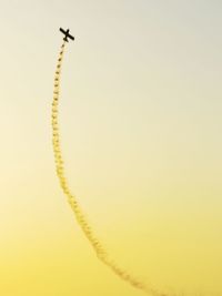 Low angle view of vapor trail against clear sky