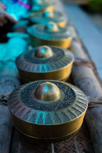 Close-up of brass containers in row