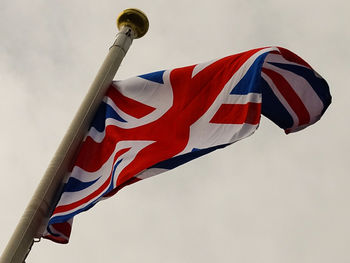 Low angle view of flag against sky