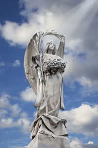 Low angle view of statue against sky