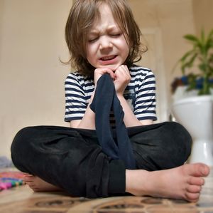 Cute boy sitting at home