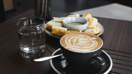 Close-up of cappuccino on table