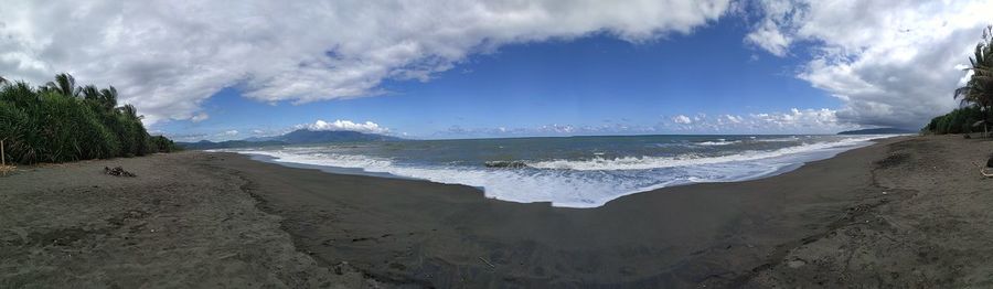 Panoramic view of beach against sky