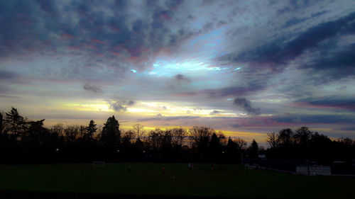 Scenic view of landscape against cloudy sky