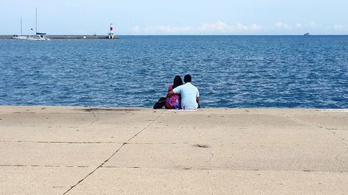 Rear view of woman looking at sea