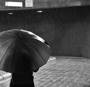 Full length of woman holding umbrella