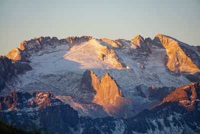 Scenic view of snowcapped mountains against clear sky