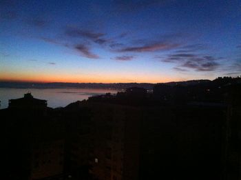 Scenic view of sea against sky at dusk