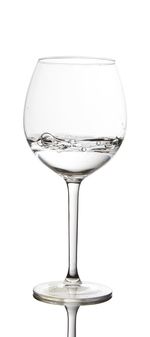 Close-up of wine glass against white background