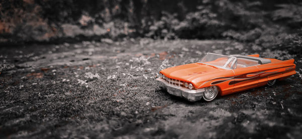 Close-up of toy car on street