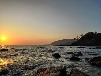 Scenic view of sea against sky during sunset