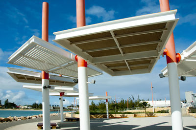 View of swimming pool by building against sky