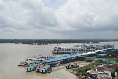 High angle view of boats moored in sea against sky