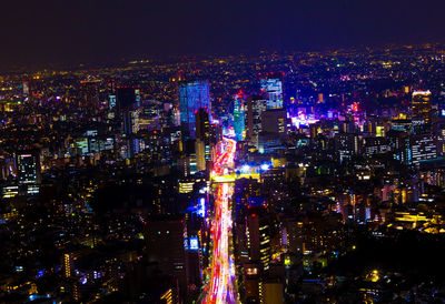 High angle view of illuminated city buildings at night