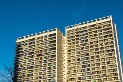 Skyscraper with blue sky in autumn light