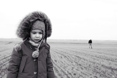 Portrait of woman standing on field