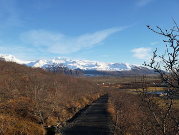 Scenic view of snowcapped mountains against sky