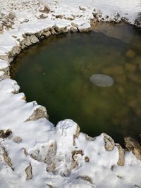 High angle view of rocks floating on lake