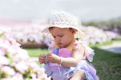 Cute girl with pink flowers