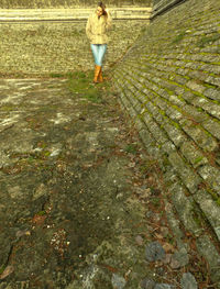 Woman walking on umbrella