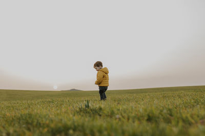 Side view child on grass field