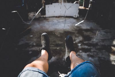 Low section of man at abandoned building