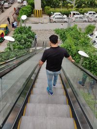 Rear view of man on railing