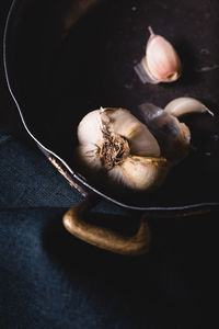 High angle view of garlic in bowl on table