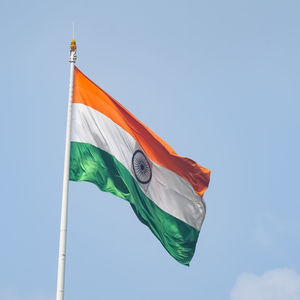 India flag flying high at connaught place with pride in blue sky, india flag fluttering, indian flag