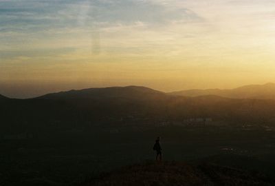 Scenic view of mountains at sunset