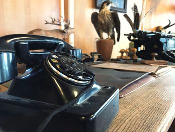 Close-up of telephone on table