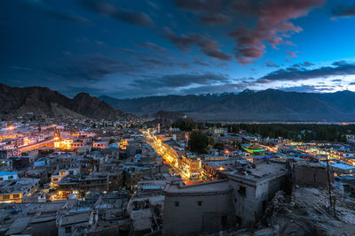 High angle view of illuminated town against sky