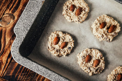 High angle view of pastry dough in baking sheet on table