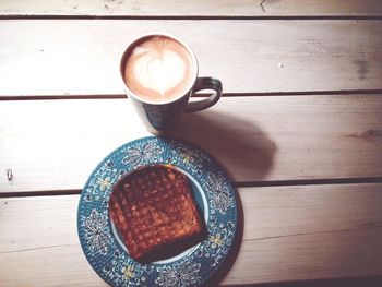 Toast and coffee with heart shaped pattern