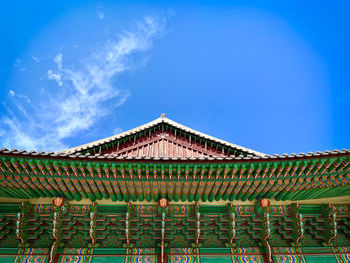 Low angle view of building against blue sky