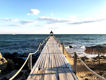 Pier over sea against sky