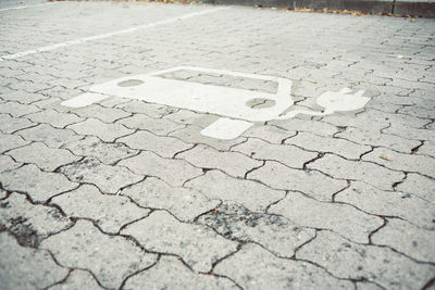 High angle view of arrow sign on road