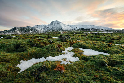 Scenic view of snowcapped mountains against sky during winter