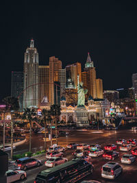 View of illuminated buildings against sky at night