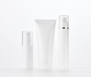 Bottle, empty white plastic tubes for cosmetics. packaging for cream, gel, serum, 